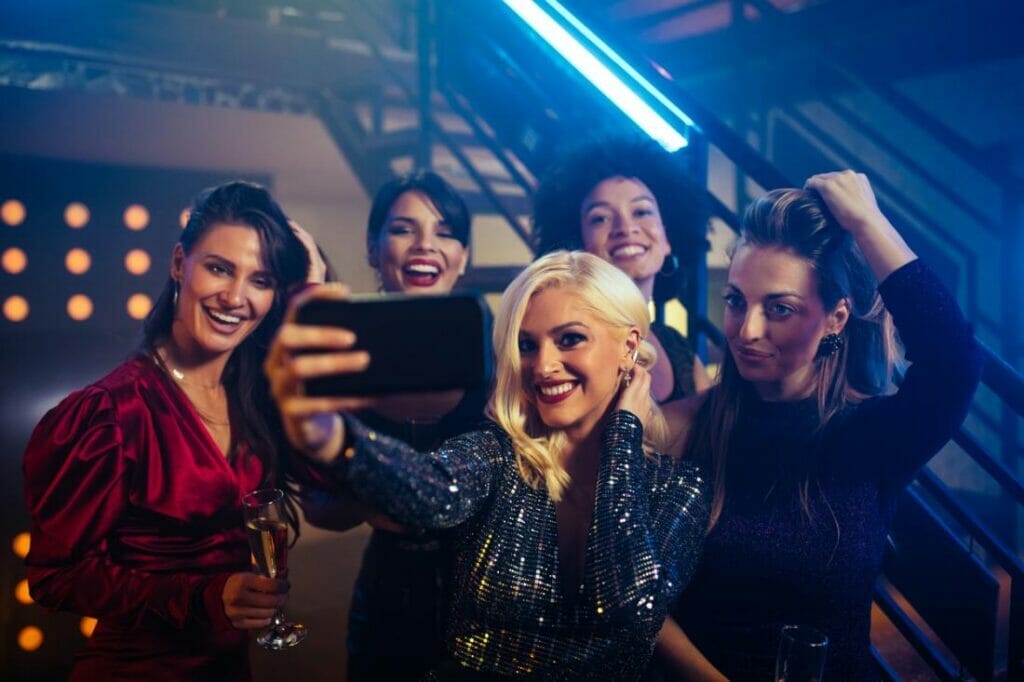 Students taking a selfie on a night out.